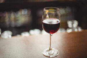 Close-up of glass with red wine on table at bar
